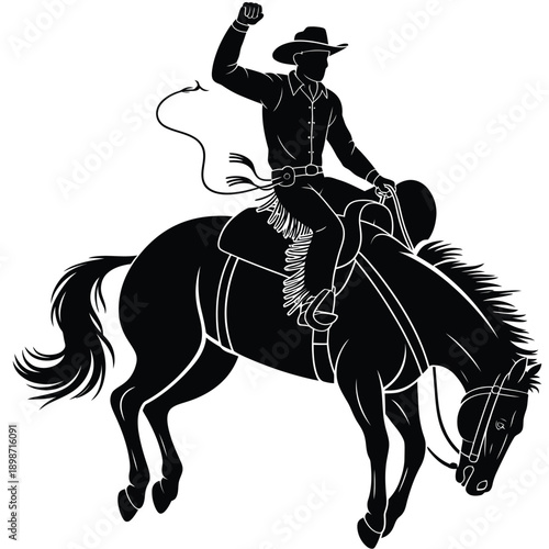 A silhouette of a cowboy riding a rearing horse with a raised arm
