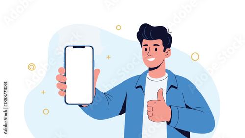 Smiling young man holding a modern blue smartphone with a blank white screen and showing a thumbs up gesture for mobile app recommendation.