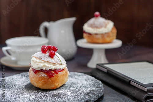 Homemade Semla or semlor, vastlakukkel, laskiaispulla - traditional Scandinavian sweet bun especially Fastelavn Shrove Monday and Shrove Tuesday.