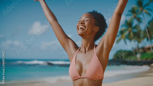 Wallpaper Mural Young woman celebrating on a tropical beach with arms raised, smiling, and palm trees in the background, possibly for a summer or vacation-themed advertisement or social media post Torontodigital.ca