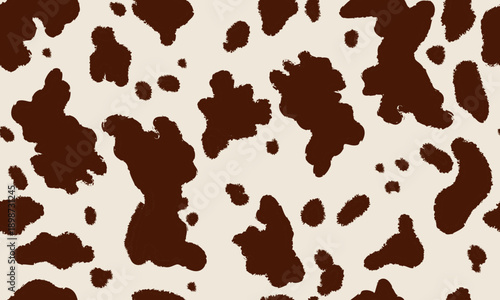Cowhide animal print seamless pattern in brown and cream tones. Cow skin spots repeating texture.