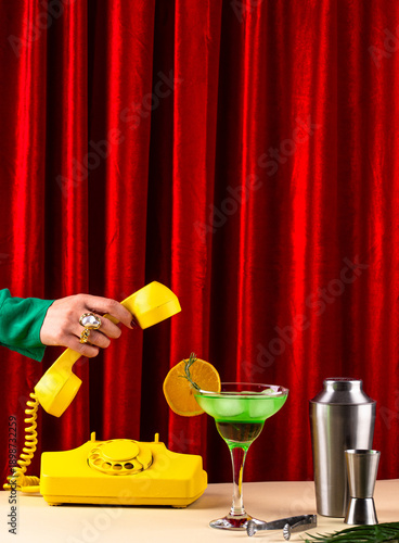 Retro green cocktail against a red curtain