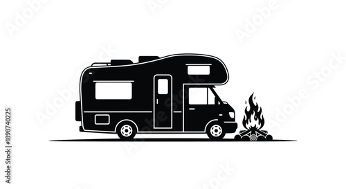 Black silhouette of an rv camper parked next to a campfire