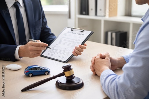 Wallpaper Mural Insurance Agent Consulting Client About Car Accident Claim with Gavel on Desk Torontodigital.ca