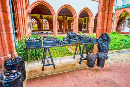 The bronze sculpture of vegetables and fruits in small cloister of Basel Minster, Basel, Switzerland
