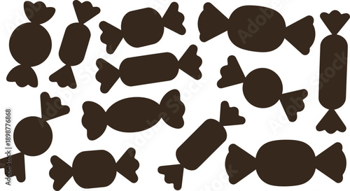 Brown candies on white background sweets wrapped heart shaped