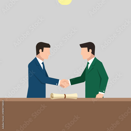 Two businessmen in suits shaking hands over a desk with a rolled-up diploma, symbolizing agreement or partnership.