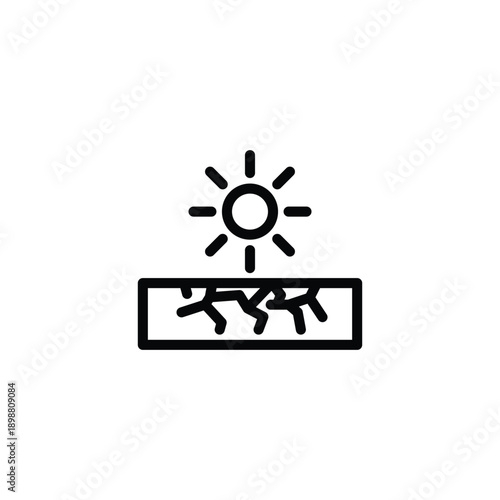 Sunlight on cracked ground dry earth drought symbol.