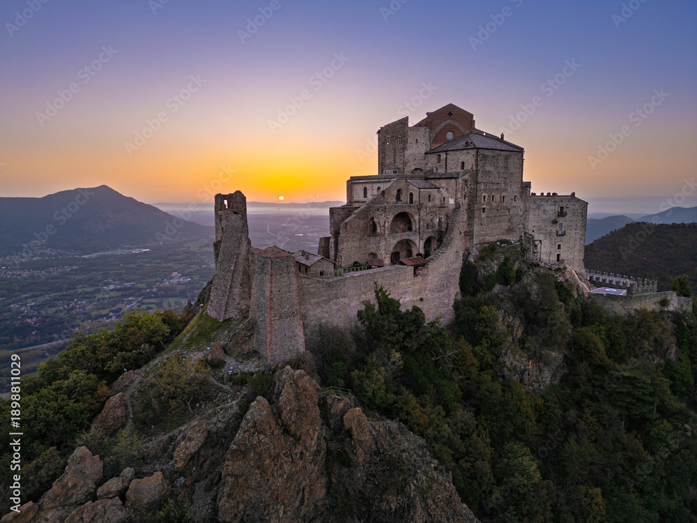 Obraz premium Aerial view of the Sacra di San Michele at dawn, Piedmont, Italy