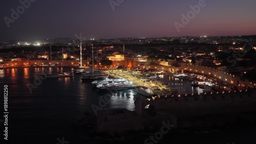 Wallpaper Mural Rodos harbor lights shine from dusk to night in Greece Torontodigital.ca