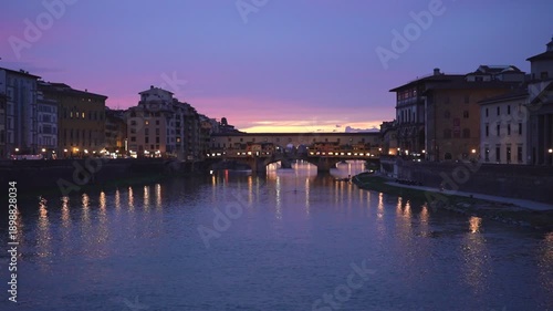 Beautiful evening landscape of the historic Ponte Vecchio and its reflections in, Florence, Italy