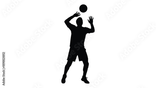 Silhouette of a person tossing a basketball in the air dynamic pose