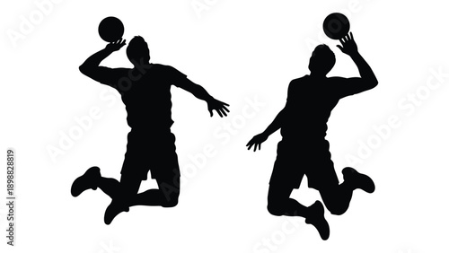 Two basketball players in mid air depicted as silhouettes during a jump shot