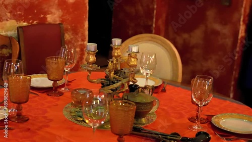 Wallpaper Mural Antique dinner table with amber glassware and ornate candelabra on orange tablecloth Torontodigital.ca