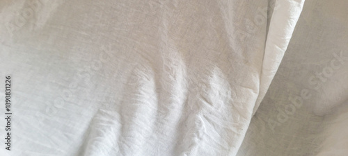 Image of a white sheet with a light-colored fabric texture.
