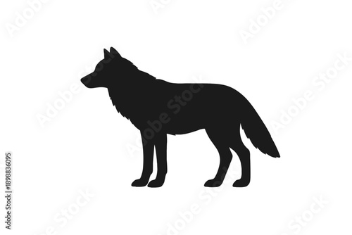 Silhouette of a wolf standing on an open plain