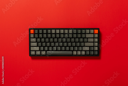 Overhead view of a mechanical keyboard on colourful background