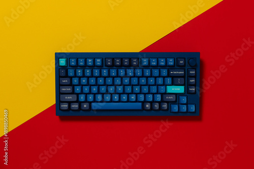 Overhead view of a mechanical keyboard on colourful background
