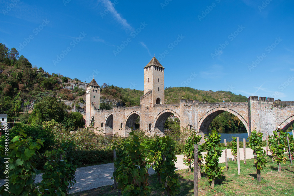 Fototapeta premium Valentré Bridge in Cahors crossing the Lot River, medieval architecture in France