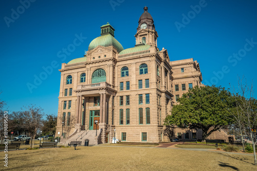 Bild auf Leinwand Front Entrance of Courthouse Building With Tall Clock Tower in Historic City of
