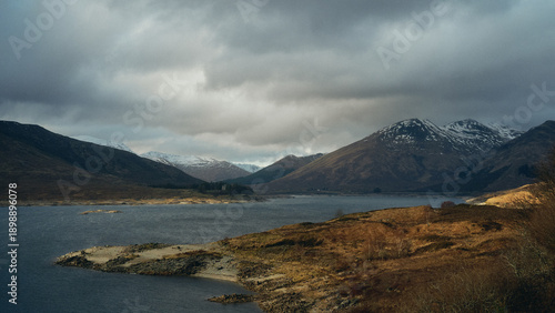 lake and mountains and moody skies