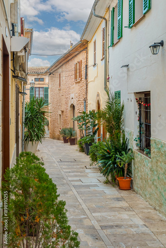 Historic town of Alcudia in Mallorca, known for its well-preserved medieval walls, charming old streets, and lively atmosphere. A popular destination offering cultural heritage, local shops, and tradi