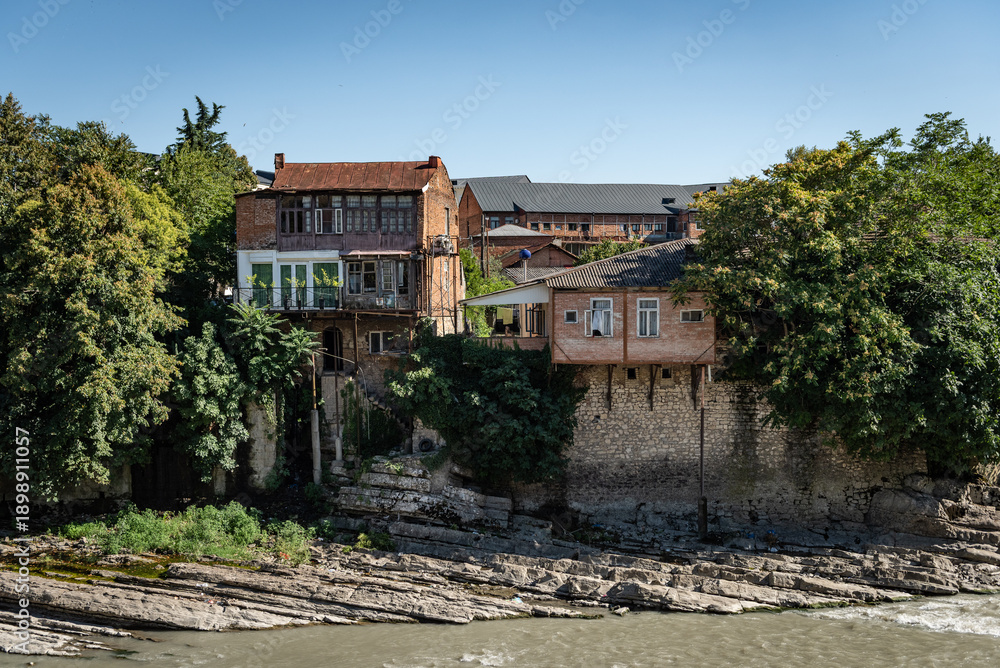 Fototapeta premium Beautiful old houses upon river Rioni in Kutaisi, Georgia