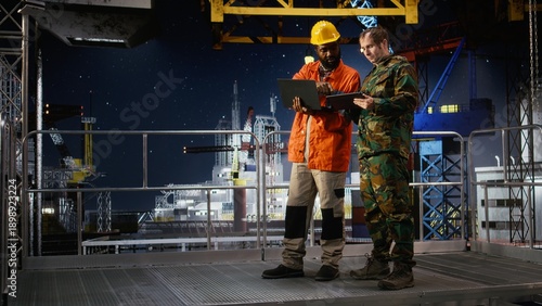 Tableau sur toile Naval officer and engineer using walkie talkie on oil rig vessel to manage threat response and border security operations, ensuring safe offshore drilling and protection of assets