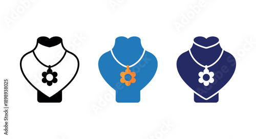 Three colorful flower-shaped necklaces on display busts with a clean and minimalist aesthetic