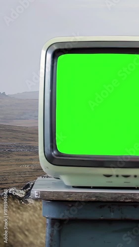Retro Television With Green Screen in Remote Landscape, Vintage TV Chroma Key, Outdoors - 4K Vertical