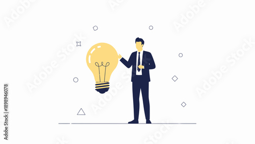 Businessman holding a glowing light bulb, symbol of innovation and ideas