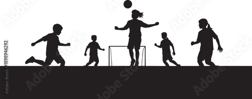 Silhouettes of children playing soccer together on a field, depicting teamwork, sport, and active play.