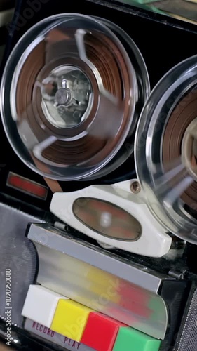 Vintage Reel to Reel Tape Recorder Spinning Reels, Analog Audio Equipment Close Up - 4K Vertical