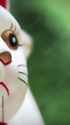 Japanese Lucky Cat Maneki Neko Waving Paw, Close Up Symbol of Good Fortune - 4K Vertical