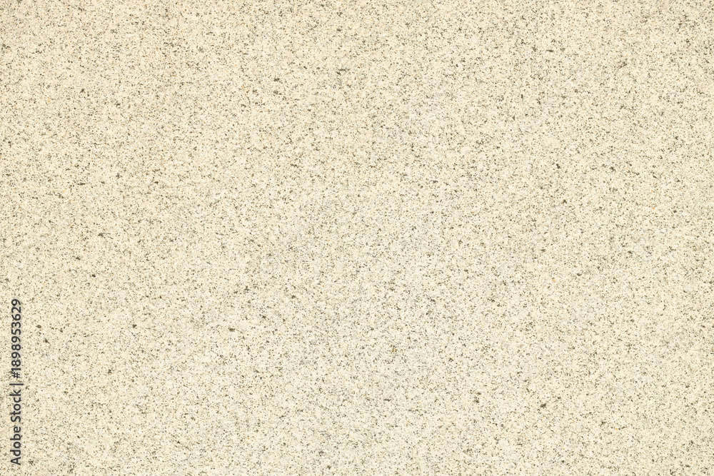 Fototapeta premium Light beige textured background with subtle speckles, ideal for design projects, presentations, or as a neutral backdrop for various visual applications