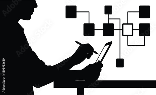 Silhouette of person using stylus on tablet with flowchart