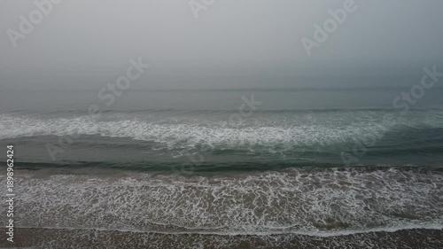 aerial top view drone video clip of scenic wave formation in a sea beach of famous travel destination city Puri in India
