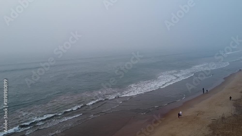 aerial top view drone video clip of scenic wave formation in a sea beach of famous travel destination city Puri in India