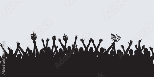 Silhouette of a crowd celebrating with dreidels and a menorah held high against a light background.