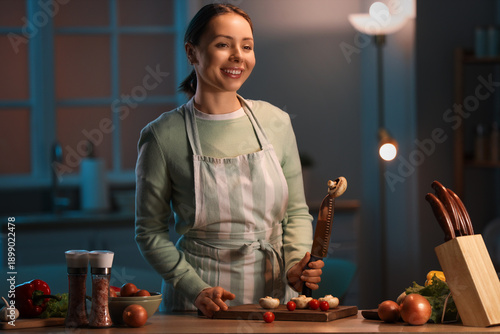 Young woman cutting mushroo...