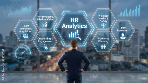 Business professional views glowing HR Analytics data on futuristic screen with blurred ci