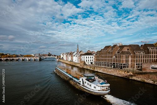 Foto Maastricht Netherlands cargo barge ship river Maas Meuse Sint Servaasbrug bridge