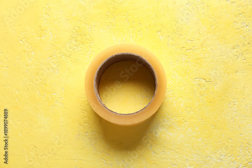 Adhesive tape roll on yello...