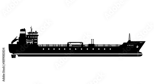 Silhouette of a large cargo ship sailing on the sea.