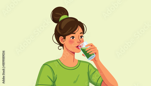 Young woman drinking a green smoothie wearing a green shirt  