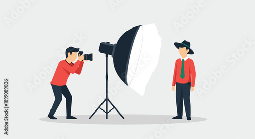 Professional Studio Photography Scene with a Photographer Taking a Portrait of a Man Wearing a Hat Using Large Studio Light Softbox Equipment