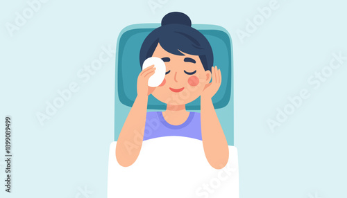 Young woman relaxing in bed while applying skincare treatment  