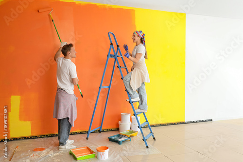 Young couple with roller an...