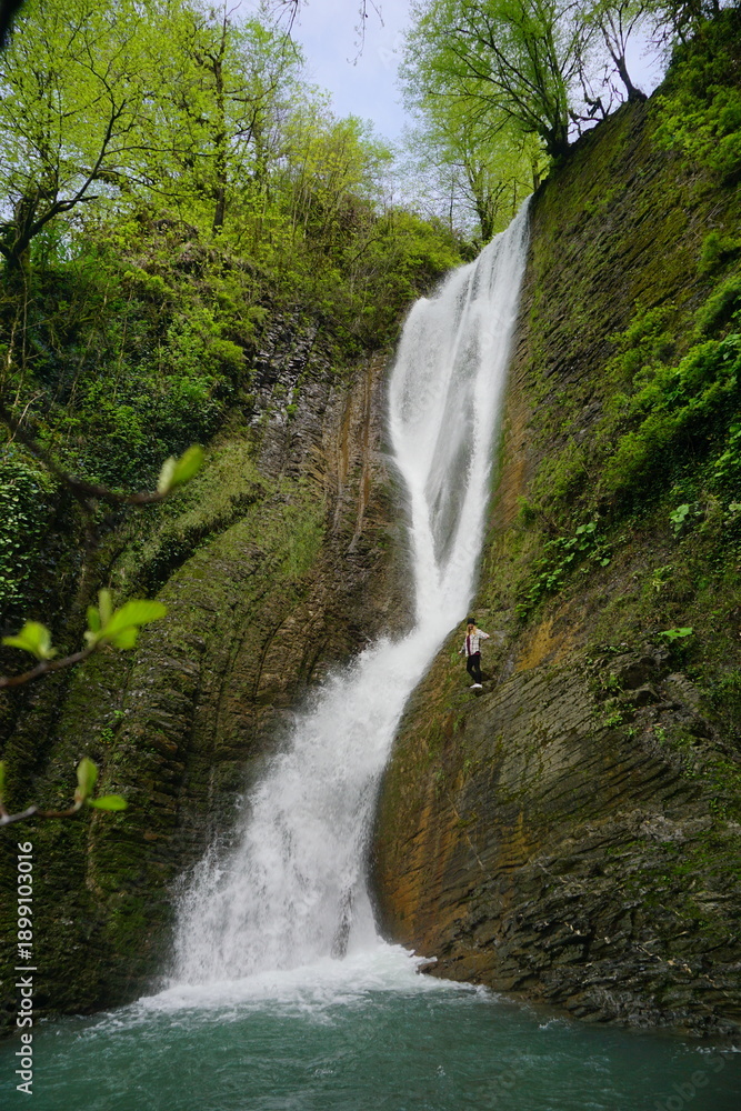 Fototapeta premium Waterfall in the mountains in the spring