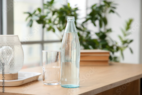 Bottle of water and glass o...